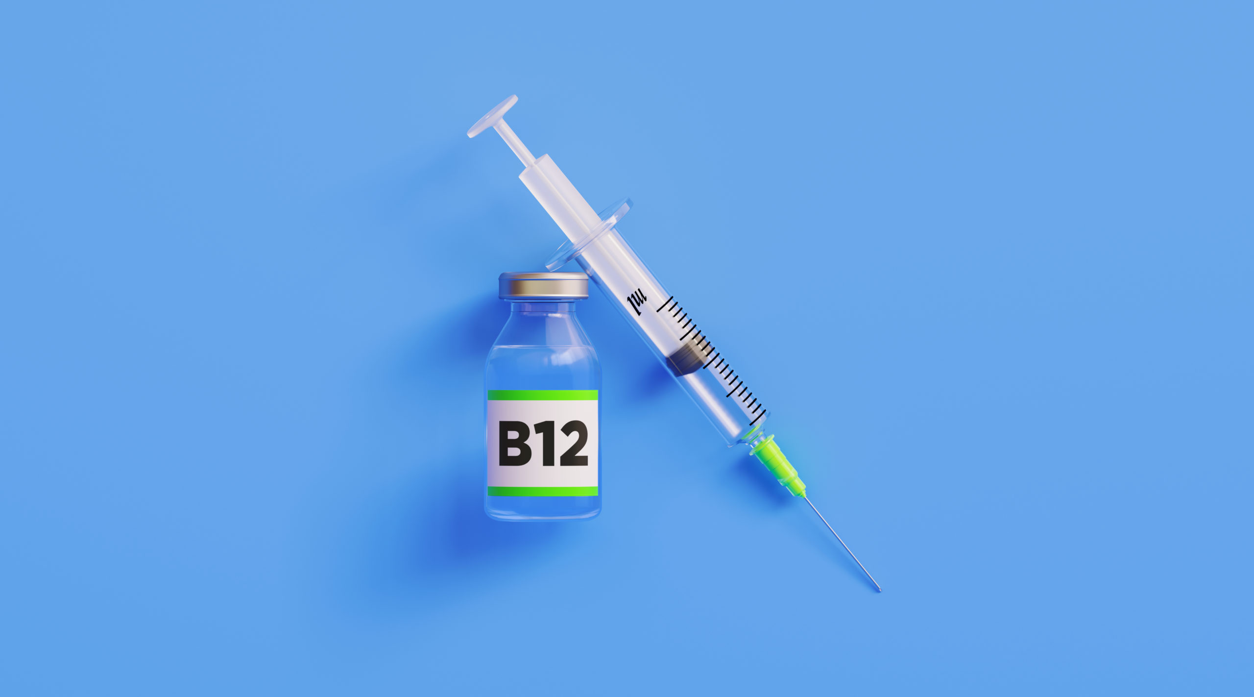 Injectable B12 Vitamin and Syringe on Blue Background.